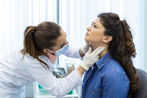 endocrinologist-examining-throat-young-woman-clinic-women-with-thyroid-gland-test-endocrinology-hormones-treatment-inflammation-sore-throat